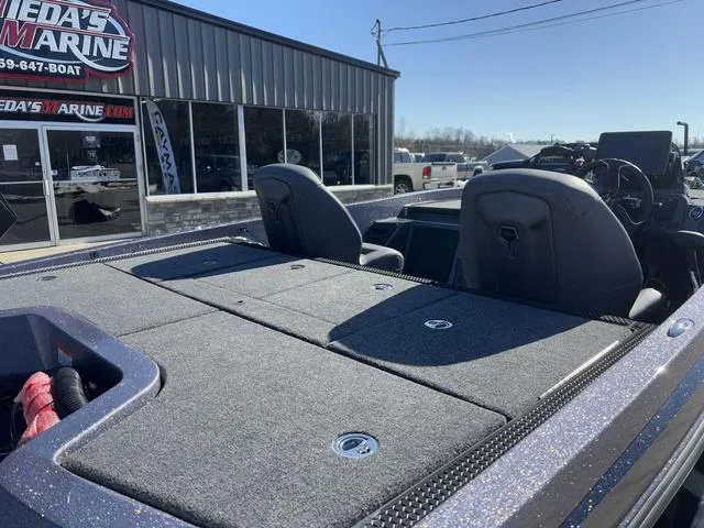 Slide: The Image of 2025 iKon VLX20 boat with spacious seating at a marina dealership. - 3