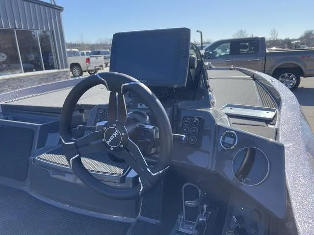 Slide: The Image of 2025 iKon VLX20 boat dashboard with steering wheel and control panel. - 5