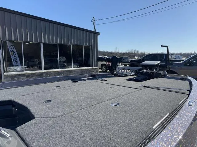 Slide: The Image of 2025 iKon VLX20 boat deck outside a showroom on a sunny day. - 6