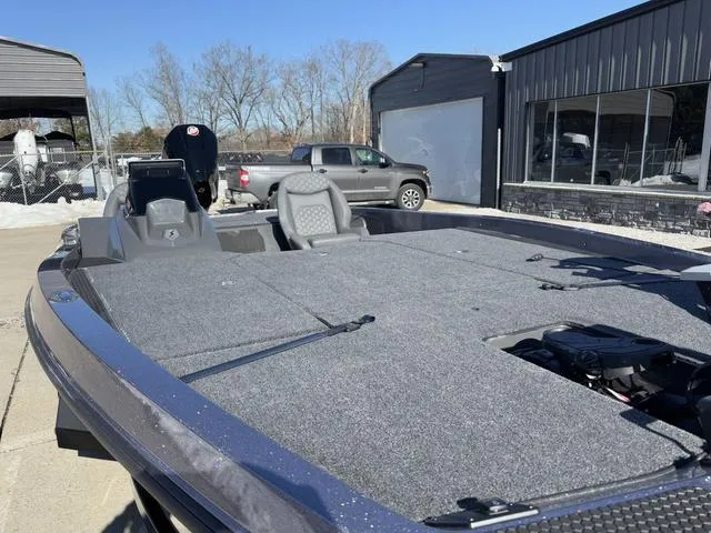 Slide: The Image of 2025 iKon VLX20 boat with spacious deck, parked outdoors on a sunny day. - 7