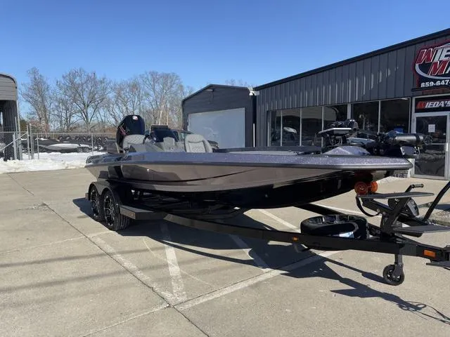 Slide: The Image of 2025 iKon VLX20 boat on trailer, parked outside dealership on sunny day. - 8
