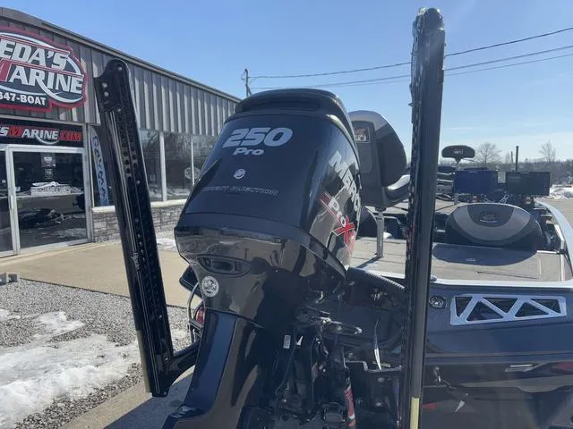 Slide: The Image of 2018 Ranger Z520L boat with Mercury 250 Pro XS engine at a marine dealership. - 2