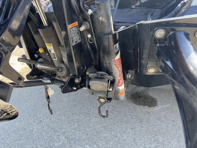 Slide: The Image of 2018 Ranger Z520L boat motor mount with hydraulic components and safety labels. - 3