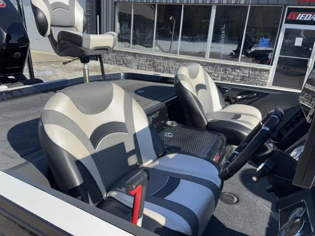 Slide: The Image of 2018 Ranger Z520L boat interior with stylish seating and modern dashboard. - 7