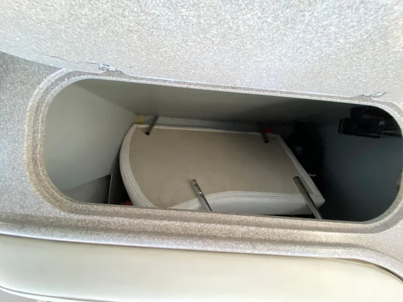Slide: The Image of Storage compartment in a 2008 Rinker 280 Express Cruiser boat. - 25