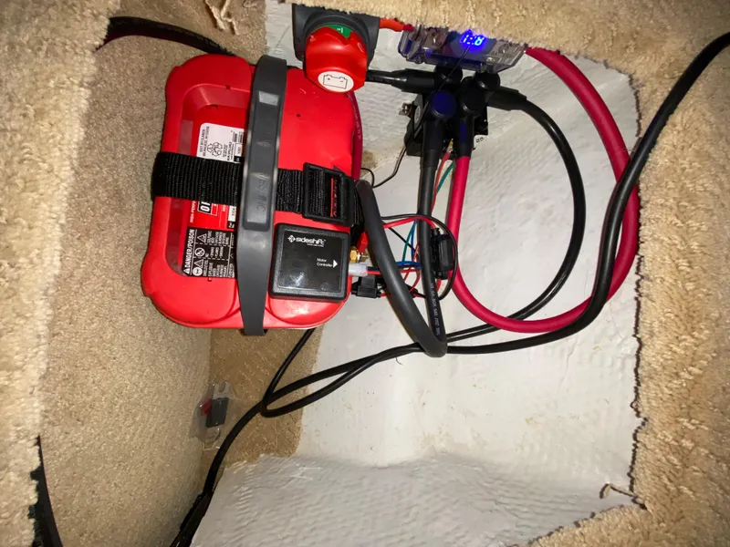 Slide: The Image of Battery compartment of 2008 Rinker 280 Express Cruiser with wiring and connections. - 28