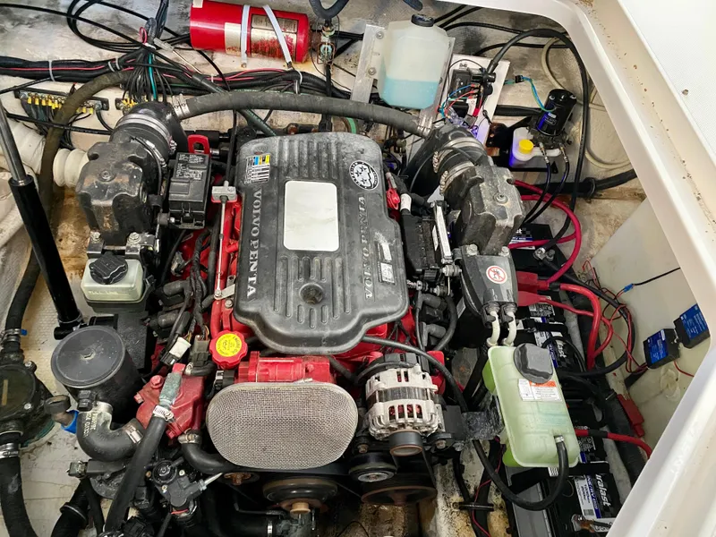 Slide: The Image of Engine compartment of a 2008 Rinker 280 Express Cruiser, featuring a Volvo Penta engine. - 31
