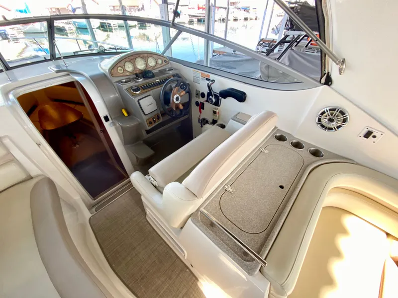 Slide: The Image of 2008 Rinker 280 Express Cruiser cockpit with steering wheel and seating area. - 40