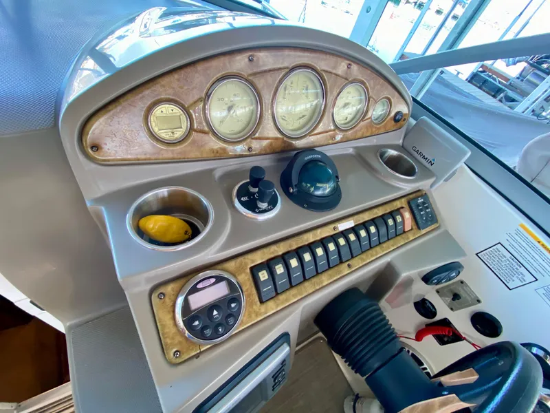 Slide: The Image of Dashboard of a 2008 Rinker 280 Express Cruiser with gauges and controls. - 41