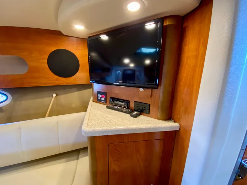 Slide: The Image of Interior of 2008 Rinker 280 Express Cruiser with TV and entertainment system. - 49