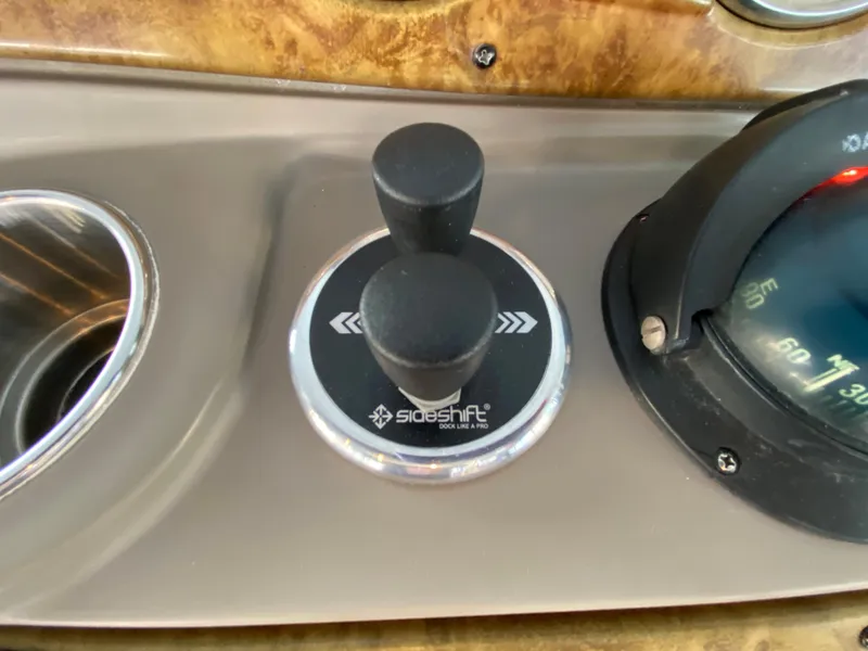 Slide: The Image of Control panel of 2008 Rinker 280 Express Cruiser with joystick and compass. - 9