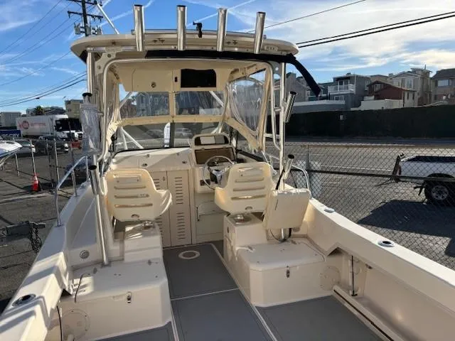 Slide: The Image of 2018 Grady-White 228 Seafarer boat interior with dual seats and steering console. - 14