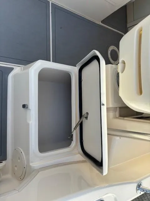 Slide: The Image of 2018 Grady-White 228 Seafarer boat storage compartment with open hatch. - 17