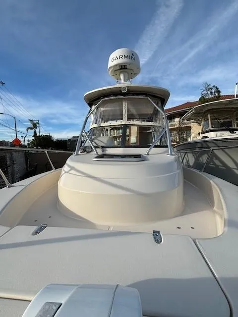 Slide: The Image of 2018 Grady-White 228 Seafarer boat with Garmin radar, docked under clear skies. - 20