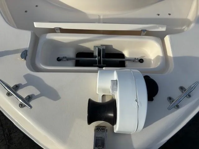Slide: The Image of 2018 Grady-White 228 SEAFARER boat anchor storage compartment with cleats and winch. - 23