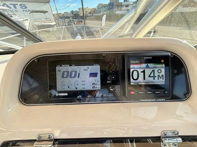 Slide: The Image of 2018 Grady-White 228 Seafarer dashboard with Yamaha and Garmin displays. - 30