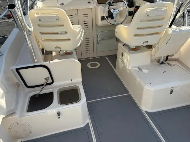 Slide: The Image of 2018 Grady-White 228 Seafarer boat interior with seating and storage compartments. - 34