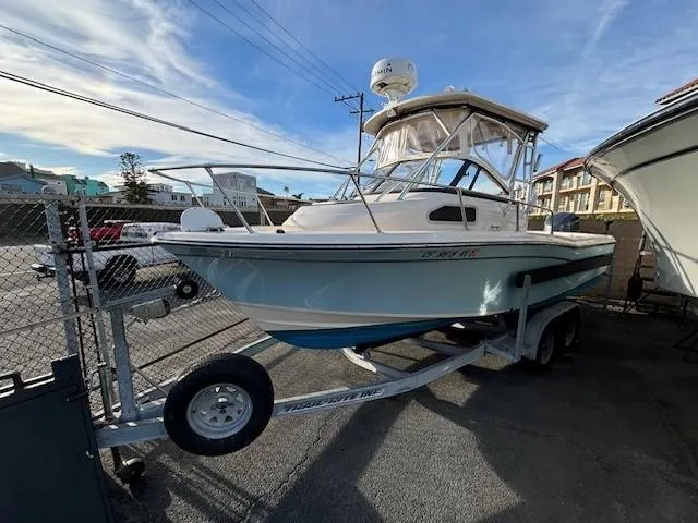 Slide: The Image of 2018 Grady-White 228 Seafarer boat on trailer in parking lot. - 38