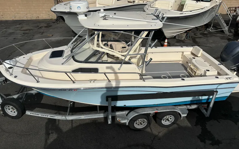 Slide: The Image of 2018 Grady-White 228 Seafarer boat on trailer, parked outdoors. - 39