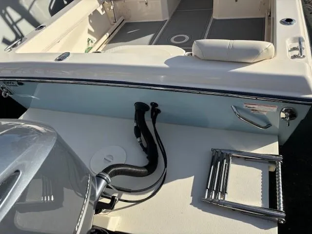 Slide: The Image of 2018 Grady-White 228 Seafarer boat interior with motor and ladder. - 44