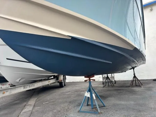 Slide: The Image of 2018 Grady-White 228 Seafarer boat hull on stands, side view. - 48