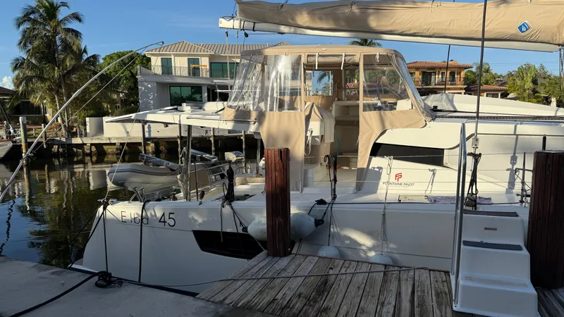 Slide: The Image of 2024 Fountaine Pajot Catamaran Elba 45 docked, featuring sleek design and modern amenities. - 1