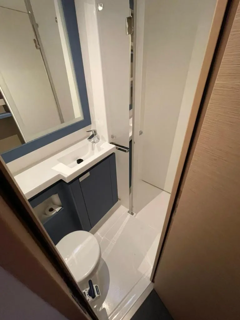 Slide: The Image of 2024 Fountaine Pajot Catamaran Elba 45 bathroom with modern fixtures and sleek design. - 6