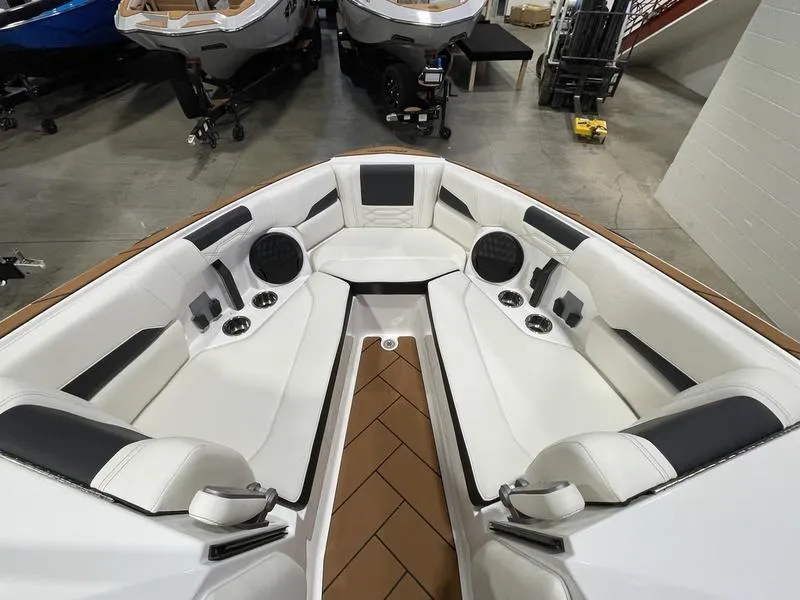 Slide: The Image of 2025 Malibu 26 LSV boat interior with white seating and modern design. - 20