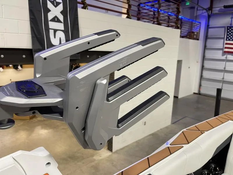 Slide: The Image of 2025 Malibu 26 LSV boat accessory in a showroom with industrial decor. - 32