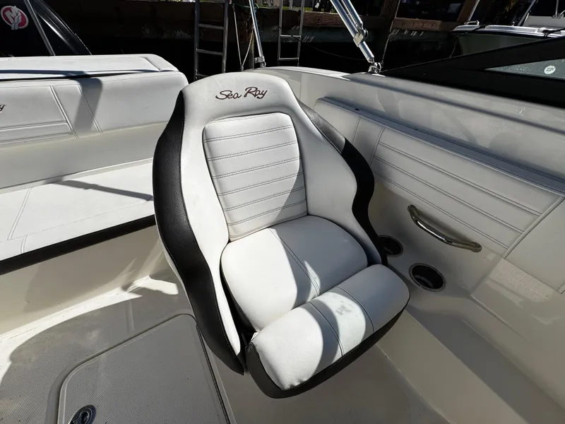 Slide: The Image of 2019 Sea Ray SPX 190 OB boat seat, white and black design, luxurious interior. - 10