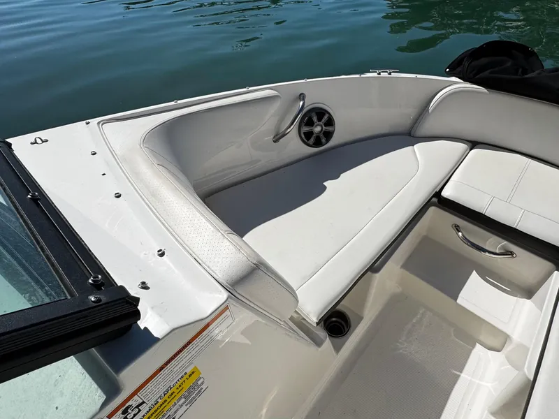 Slide: The Image of 2019 Sea Ray SPX 190 OB boat interior with white seating and speaker detail. - 16