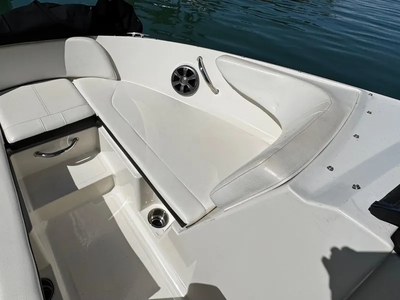 Slide: The Image of 2019 Sea Ray SPX 190 OB boat interior with white seating and speaker detail. - 17