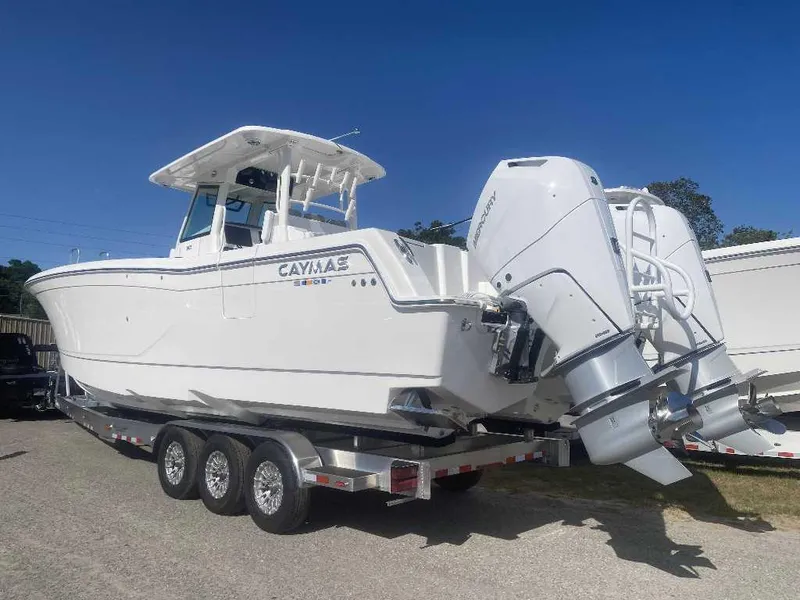 Slide: The Image of 2025 Caymas 34 CT boat cruising on open water, showcasing sleek design and performance. - 0