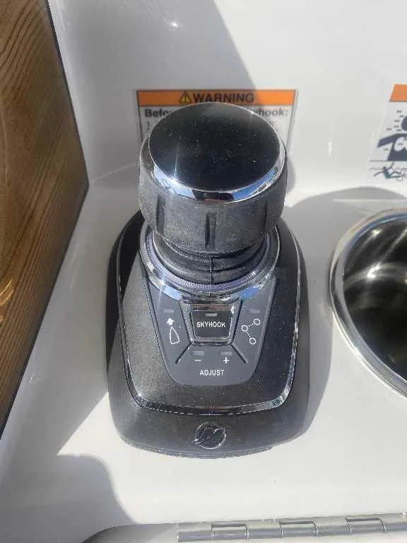 Slide: The Image of Joystick control panel on a 2025 Caymas 34 CT boat with Skyhook feature. - 11