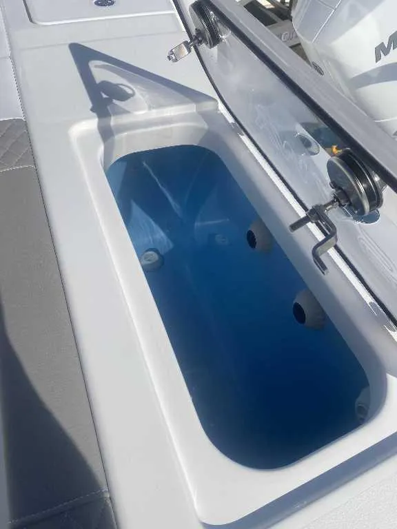 Slide: The Image of Livewell compartment on 2025 Caymas 34 CT boat, featuring a sleek design and modern fittings. - 17