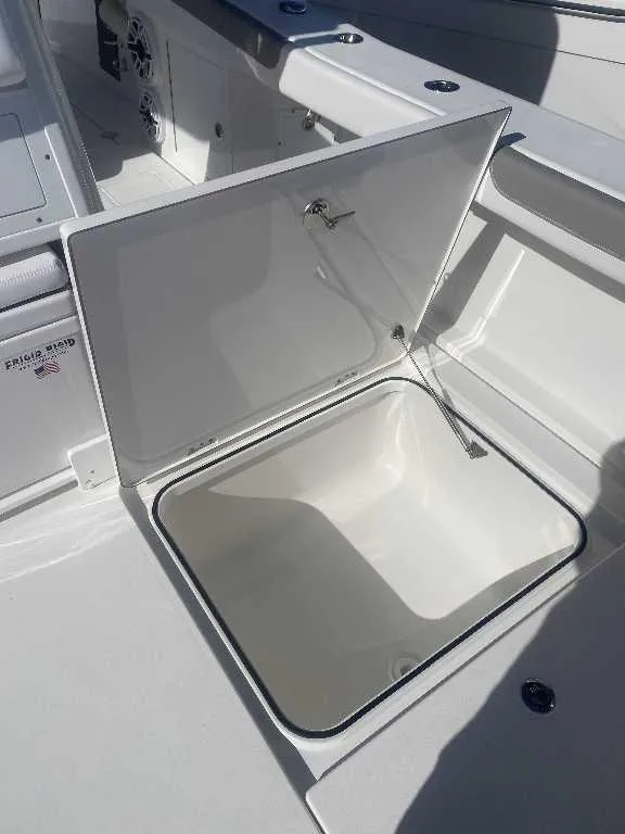 Slide: The Image of Open storage compartment on 2025 Caymas 34 CT boat, showcasing spacious interior. - 20