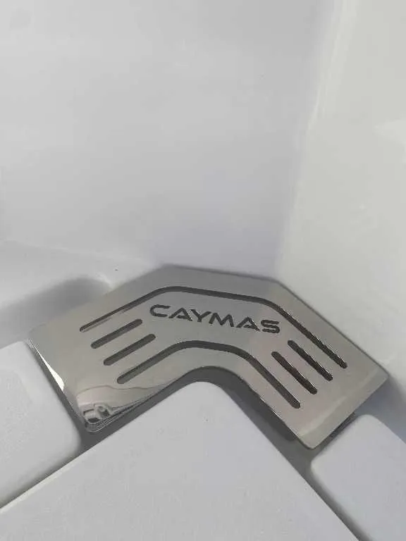 Slide: The Image of 2025 Caymas 34 CT logo on sleek metallic surface. - 21