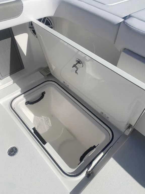 Slide: The Image of Open storage compartment on 2025 Caymas 34 CT boat, featuring sleek design and durable materials. - 22