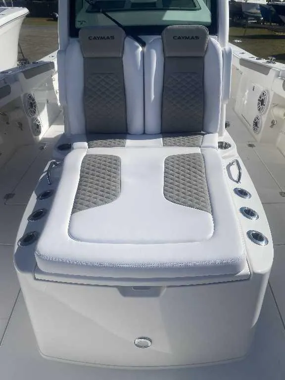 Slide: The Image of 2025 Caymas 34 CT boat interior with cushioned seating and modern design. - 3