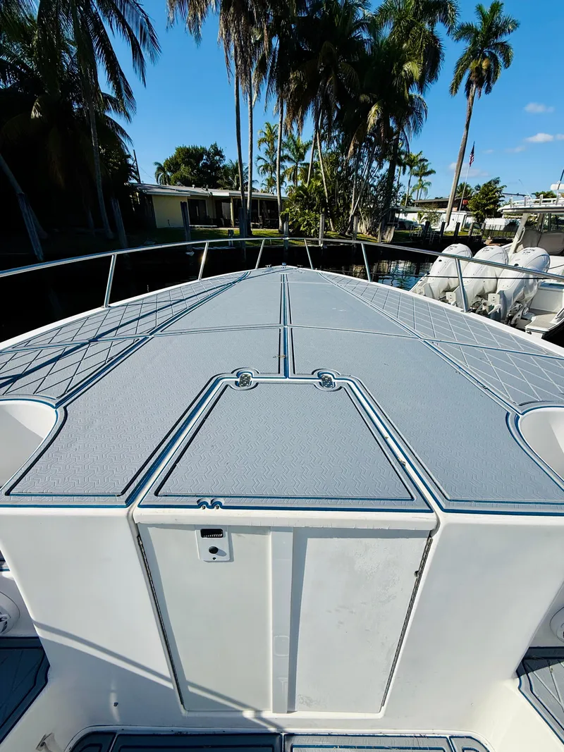 Slide: The Image of 2003 Fountain 38 TE boat deck with palm trees in the background. - 5