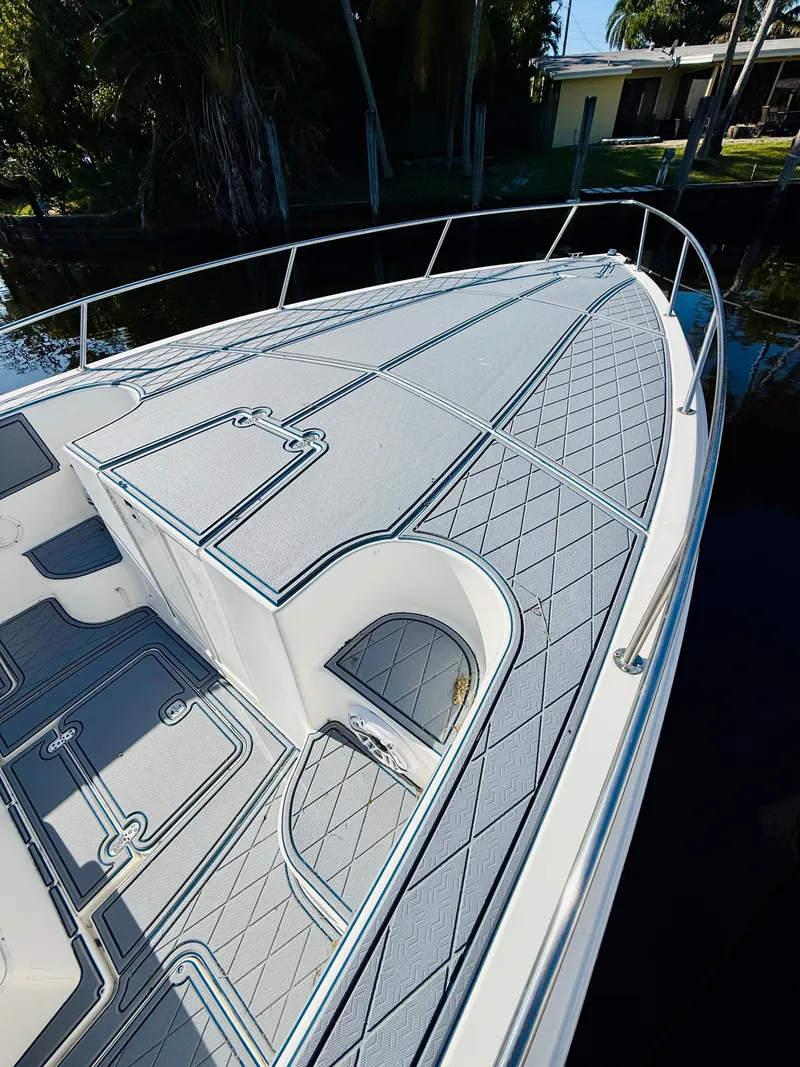 Slide: The Image of 2003 Fountain 38 TE boat deck with sleek design and textured flooring. - 6