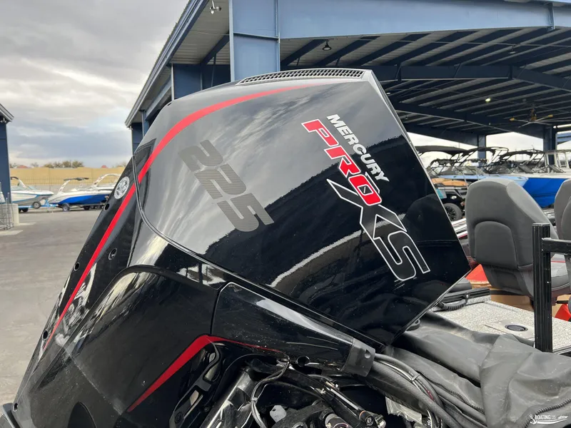 Slide: The Image of Mercury Pro XS 225 engine on 2023 Tracker V-19 boat, in a marina setting. - 12
