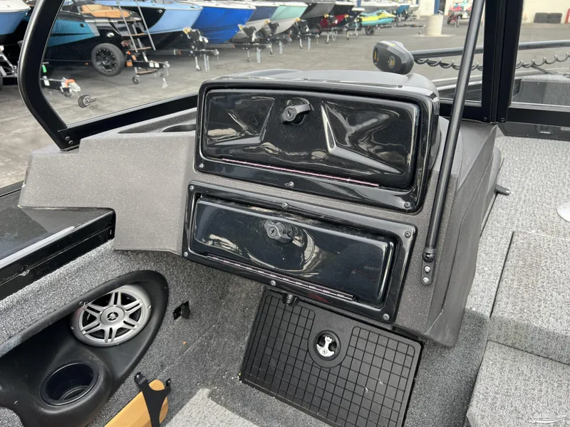 Slide: The Image of Interior of 2023 Tracker V-19 boat with dashboard and speaker detail. - 8