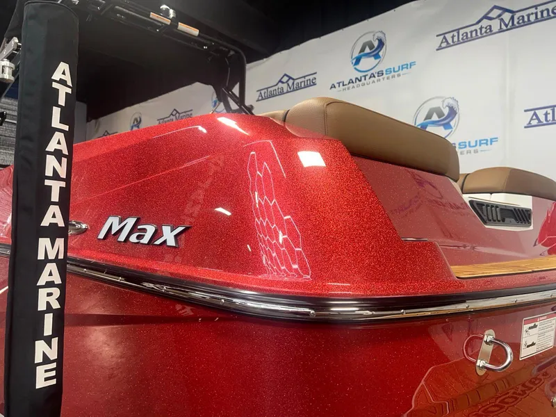 Slide: The Image of 2025 Moomba Max boat in red, displayed at Atlanta Marine showroom. - 10