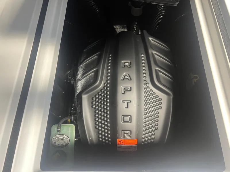 Slide: The Image of 2025 Moomba Max engine compartment featuring a Raptor engine cover. - 25