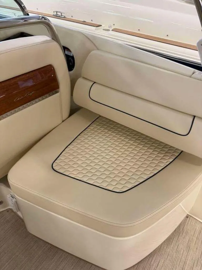 Slide: The Image of 2025 Chris-Craft Launch 31 GT interior with beige leather seating and wood accents. - 11