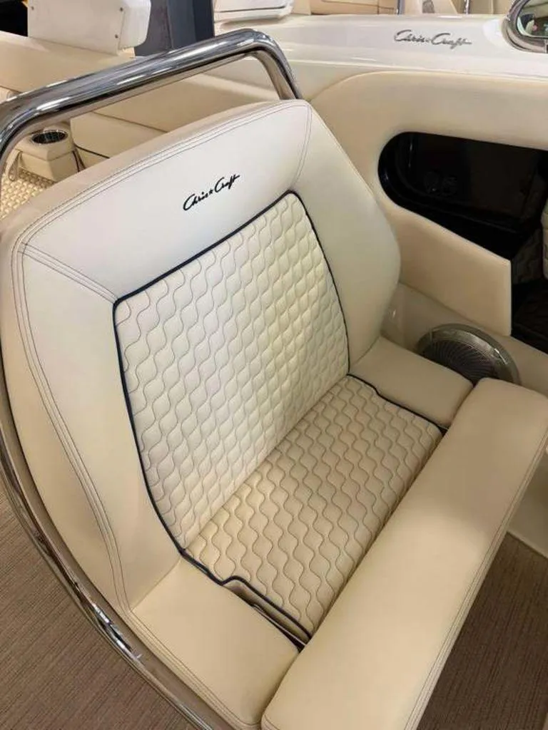 Slide: The Image of Luxurious seating in 2025 Chris-Craft Launch 31 GT boat, featuring elegant cream upholstery. - 5