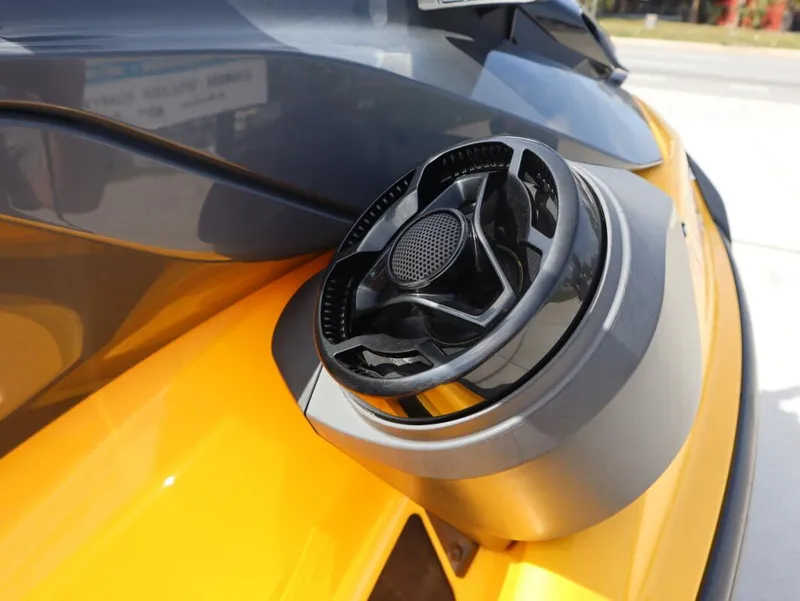Slide: The Image of 2022 Sea-Doo GTR 230 close-up of speaker detail on yellow body. - 4