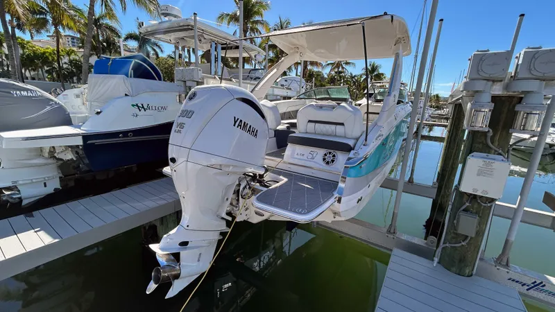 Slide: The Image of 2022 Regal LX6 boat with Yamaha engine docked at marina. - 11