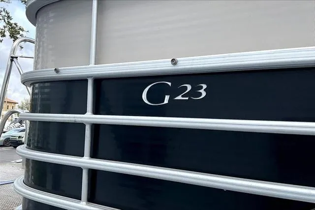 Slide: The Image of 2014 Bennington 2375 GCW pontoon boat with "G23" marking on the side. - 18
